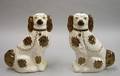 Pair of English Copper Lustre Staffordshire Seated King Charles Spaniels