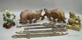 Four Asian Carved Hardstone Figures and Two Pairs of Carved Hardstone Edged Weapons