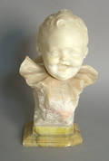 Carved stone bust of a child signed Brooks