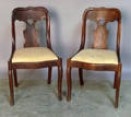 Pair of mahogany saber leg chairs