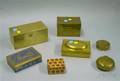 Seven Brass and Ceramic Covered Boxes