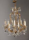 Louis XV Style Brass and Colorless Glass Nine Light Chandelier