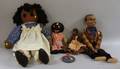Three Cloth Black Dolls a Black Composition Doll and a Plastic Ventriloquists Doll