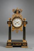 French Empire Revival Parcelgilt and Black Patinated Mantel Clock