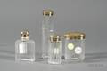 Set of Four Edward VII Goldwashed Silverlidded Colorless Glass Travel Jars