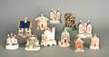 Eleven Staffordshire cottage banks and pastille burners