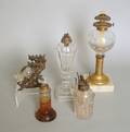 Four glass oil lamps