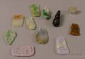 Eleven Assorted Carved Jade Pendants and Other Items