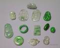 Green Jade Saddle Ring and Twelve Mostly Jade Pendants and Beads