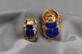 Two 18kt Gold and Lapis Scarab Brooches