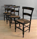 Set of four painted rush seat chairs