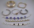 Eight Mostly Silver Bracelets