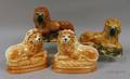 Two Pairs of Staffordshire Recumbent Lion Figures