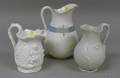 Three Assorted Decorated Ceramic Pitchers