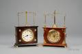 Two Ignatz Torsion Pendulum Clocks