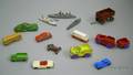 Fifteen Painted Metal Cars Trucks Ships and Railroad Cars