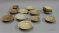 Approximately Fifteen Slip and Celadon Glazed Saucer Dishes
