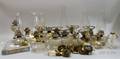 Seventeen Colorless Pressed Glass Kerosene Lamps