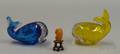 Two Italian Bubble Glass Figures of Whales and a Small Amber Figure of a Child