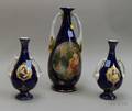 Austrian and a Pair of German Gilt Cobalt Glazed DoubleHandled Vases