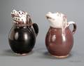 Two Tin Glazed Earthenware Hound Jugs