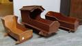 Three Stained Pine Doll Cradles