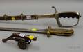 Two Modern Swords and a Miniature Bronze Canon