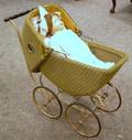 Composition Shoulder Head Doll and a Wicker Doll Carriage