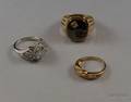 Two Ladys 10kt Gold and Gemset Rings and a Mans Gold and Hematite Intaglio Ring