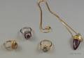 Three 14kt Gold Gemset Rings and a 14kt Gold Amethyst and Moonstone Cabochon Necklace