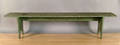 Green painted bench together with a country work table