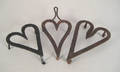 Two heart shaped wrought iron trivets 19th c