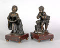 Pair of continental bronze statuettes of a boy and girl 19th c