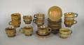 Ten brown glazed redware cups and saucers by Stahl dated 1938