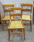 Three Classical Carved Tiger Maple Side Chairs with Caned Seats