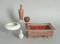 Chinese sang de beouf planter together with three small vases and a pottery dish