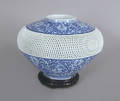 Chinese porcelain urn with lattice body