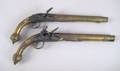 Pair of Middle Eastern brass flintlock pistols