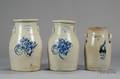 Three Stoneware Churns with Colbalt Floral Decoration