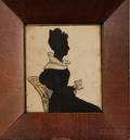 Silhouette of a Woman Sitting Holding a Book