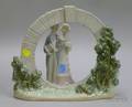 Lladro Porcelain Wedding Bride and Groom Figural Group and a Lladro Porcelain Circular Arch