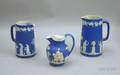Three Wedgwood Dark Blue Pitchers