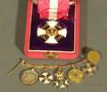 Boxed Gilt Metal ItaloGerman Order and a Waistcoat Chain of Miniature Orders