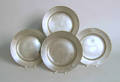 Four pewter plates bearing the touch of William Cooke