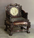 Chinese carved and inlaid armchair with silkwork panel