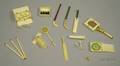 Approximately Thirteen Miniature Ivory British Sporting Equipment Articles