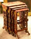 Nest of Four Japanese Gilt Decorated Red Lacquered Stands