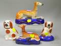 Two English Staffordshire Recumbent Whippet Figural Pen Stands and Two Small Seated Spaniel Figurals