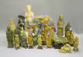 Twentytwo Chinese Pottery and Carved Stone Figures and an Asian Glazed Ceramic Elephant