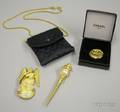 Chanel Miniature Quilted Purse Chanel Costume Brooch and Two Karl Lagerfeld Costume Brooches